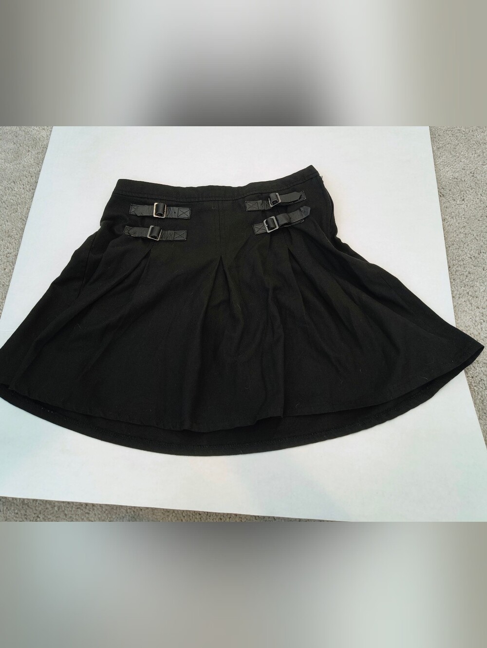 Hot Topic black pleated mini skirt with buckles in size M.